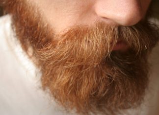 What are the reasons behind a patchy beard?